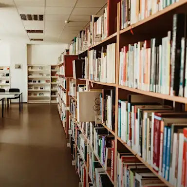 A library with bookshelves filled with books.